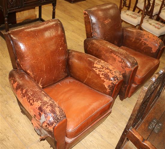 A pair of brown leather French club chairs